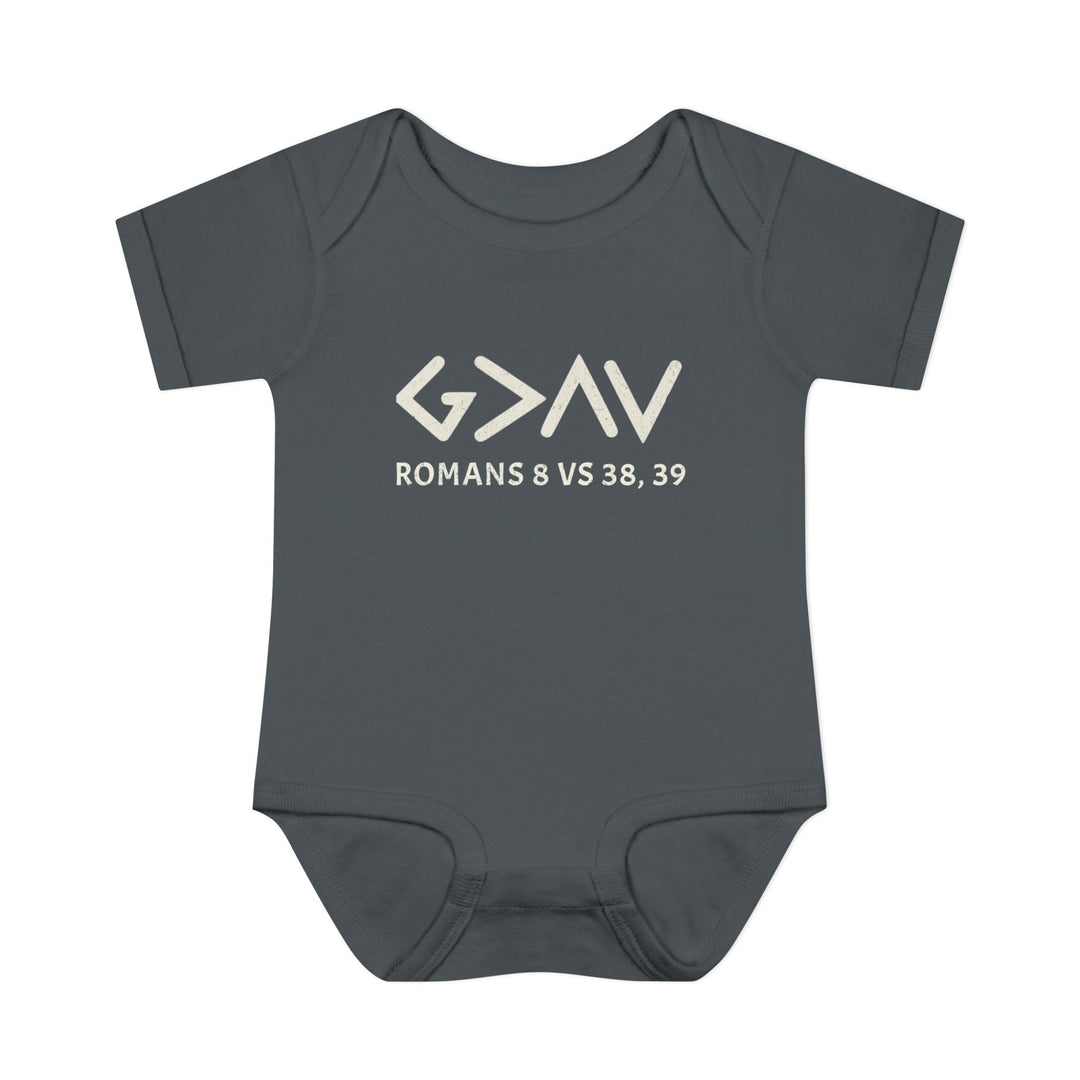 God is Greater Onesie: A grey baby bodysuit with white text, featuring lap shoulders and soft, 100% combed ringspun cotton, perfect for infants' comfort.