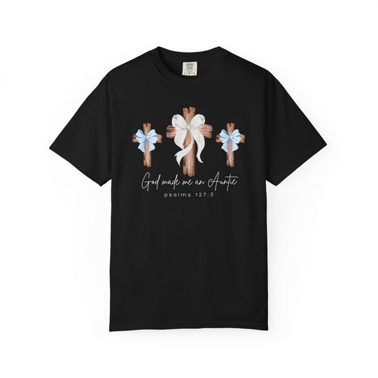 God Made Me a Boy Auntie Tee features three wooden crosses with ribbons and a slogan, crafted from soft, durable, garment-dyed cotton for a relaxed fit.
