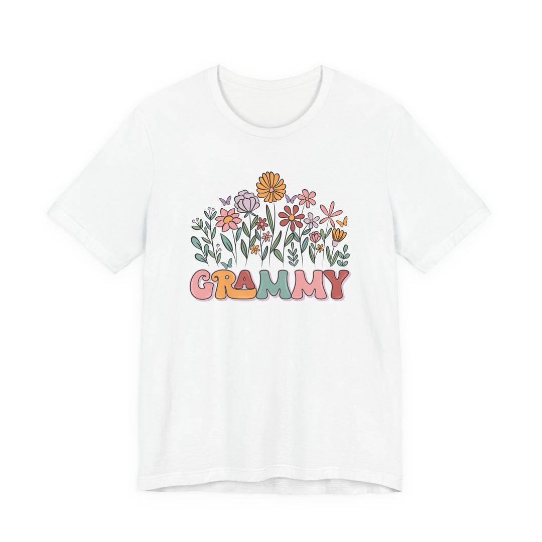 Grammy Flower Tee featuring pastel hand-drawn flowers and butterflies above GRAMMY in colorful bubble letters, on a soft, unisex cotton jersey.