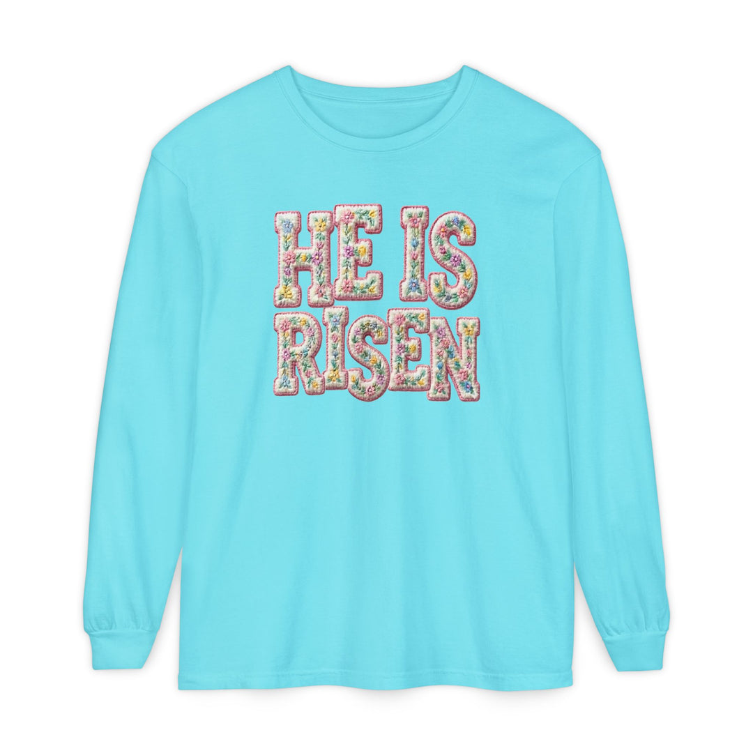 He is Risen Long Sleeve Tee with floral-patterned lettering, made of soft, 100% ring-spun cotton for a relaxed fit, ideal for casual wear.