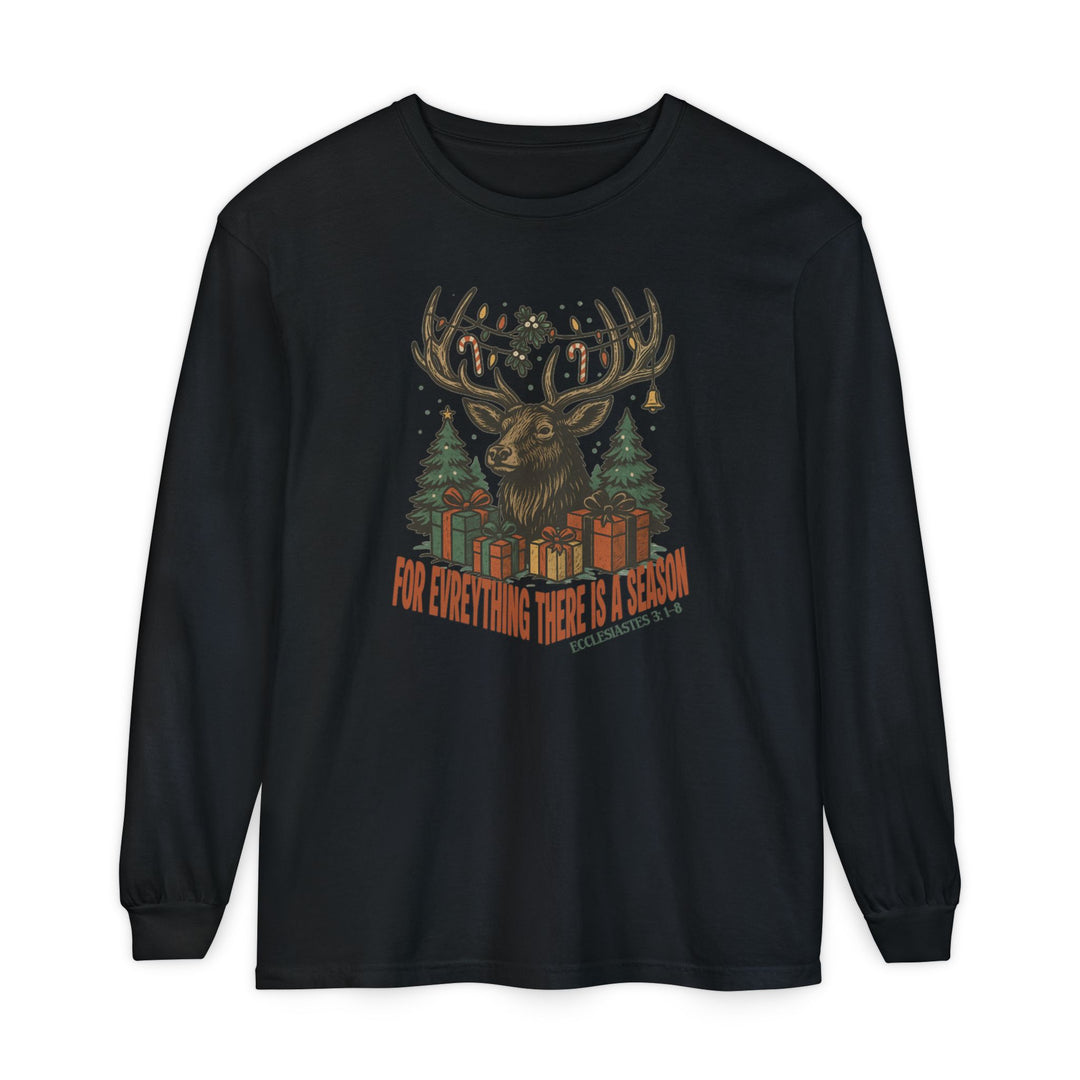 Black long-sleeve T-shirt featuring a Christmas-themed stag graphic with decorated antlers, evergreen trees, and gifts. Includes For Everything There is a Season and Ecclesiastes scripture.