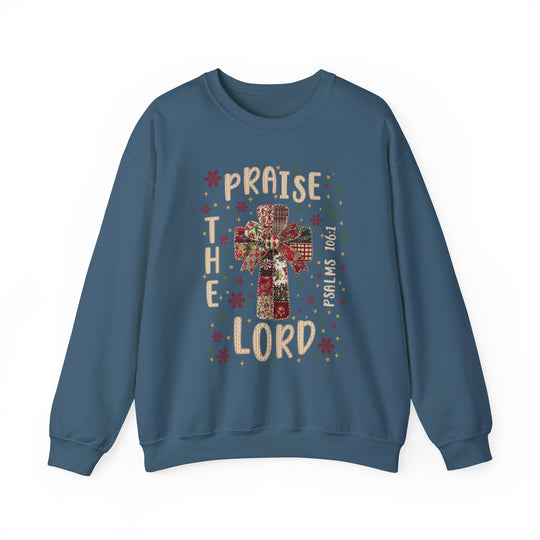 Praise the Lord Crew sweatshirt features a festive quilt-style cross with star and snowflake motifs, scripture reference, and durable, comfortable fabric blend for colder months.