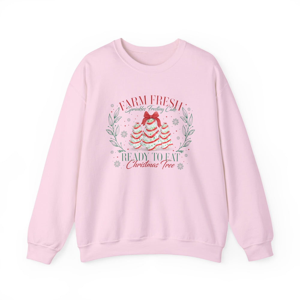 Light-pink crewneck sweatshirt featuring festive cake-styled trees and sprinkles with Farm Fresh Sprinkles Frosting Cake text, ideal for cozy, stylish holiday wear.