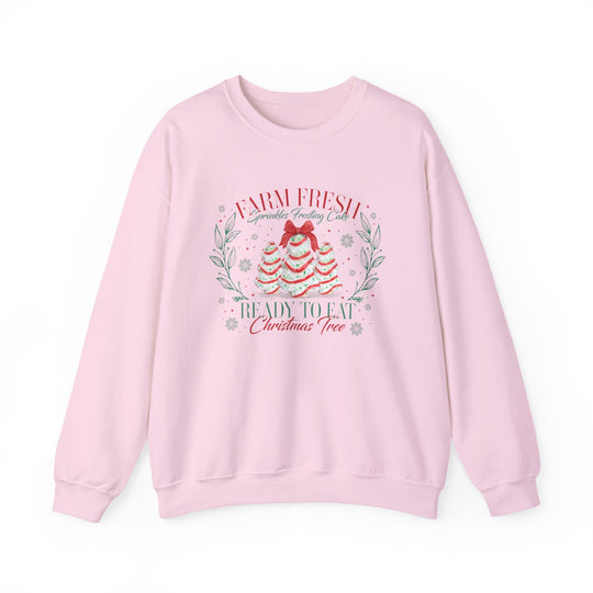 Light-pink crewneck sweatshirt featuring festive cake-styled trees and sprinkles with Farm Fresh Sprinkles Frosting Cake text, ideal for cozy, stylish holiday wear.