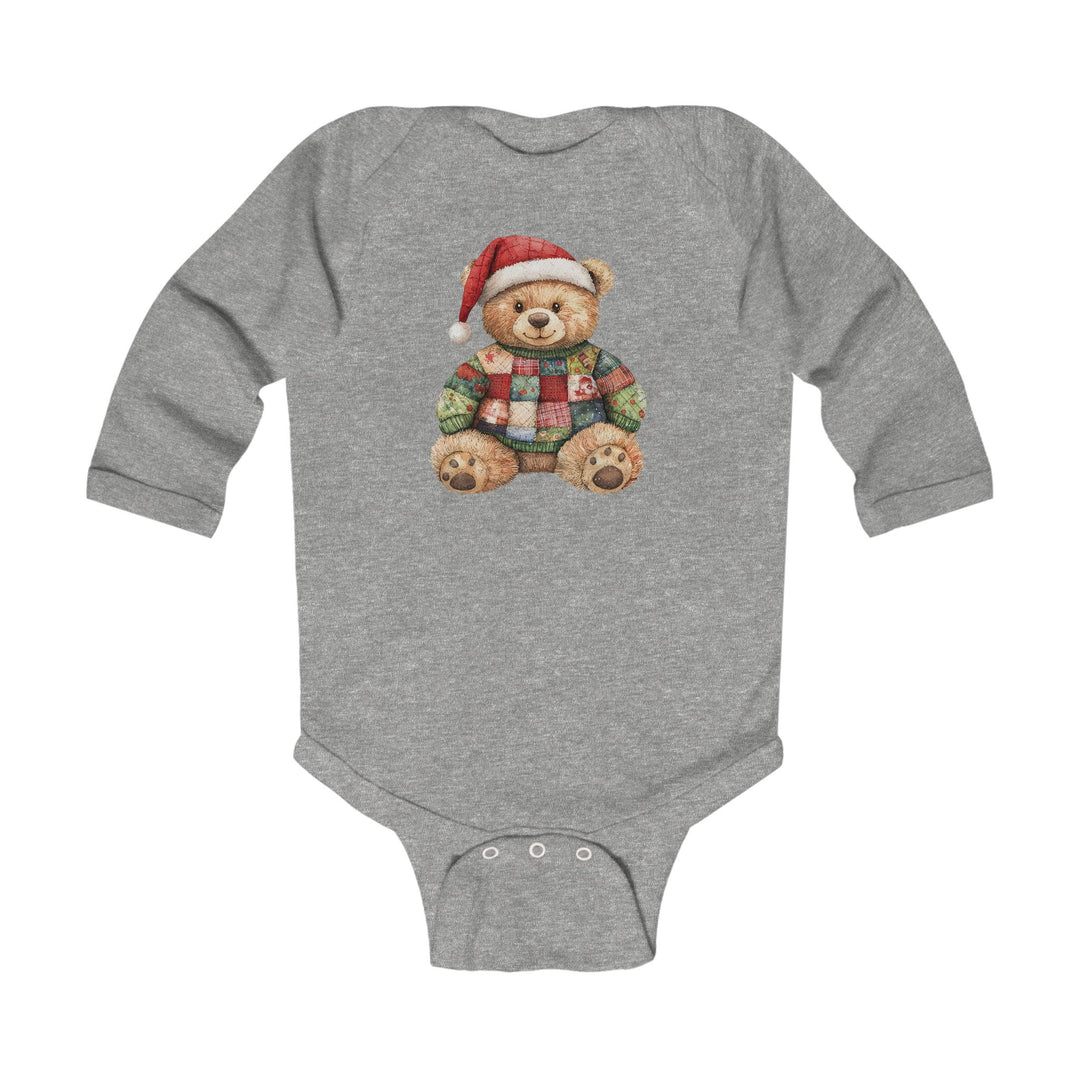 Christmas Bear Onesie featuring a teddy bear with a Santa hat and patchwork sweater, designed for easy changing with snap closures at the crotch.