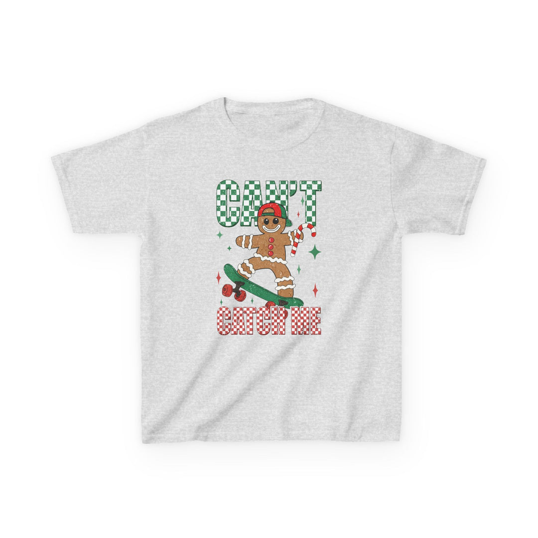 Can't Catch Me Kids Tee featuring a festive skateboarding gingerbread man with a red cap and candy cane on a light-gray background. Ideal for holiday fun and everyday wear.