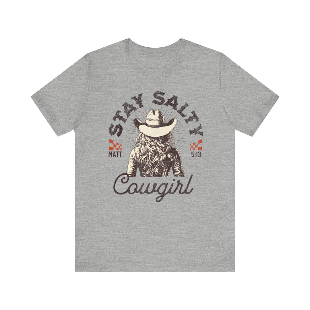 Stay Salty Tee featuring a cowboy hat design, worn by a woman. Classic unisex jersey, soft cotton, and ribbed knit collar for durability.
