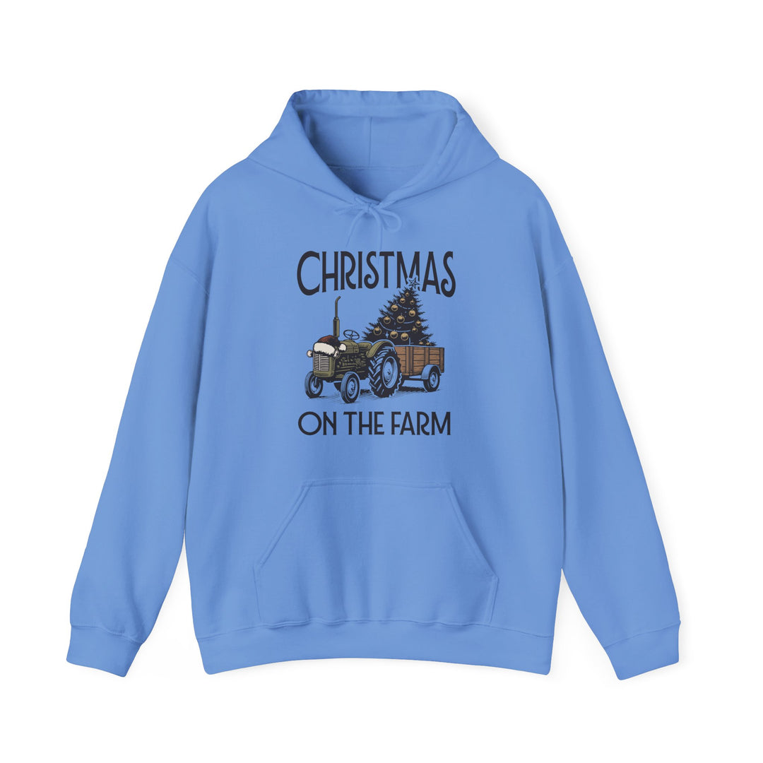 Christmas at the Farm Hoodie featuring a vintage tractor with a festive tree, cozy blend for warmth. Ideal for cold days with practical kangaroo pocket.