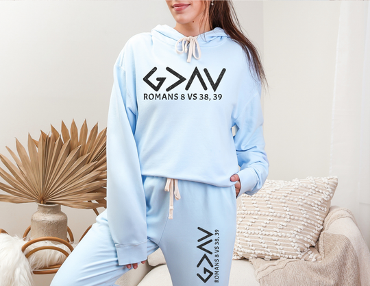 Woman wearing God is Greater Sweatpants, showcasing relaxed fit and vintage style of the lightweight fleece made from American-sourced ring-spun cotton.