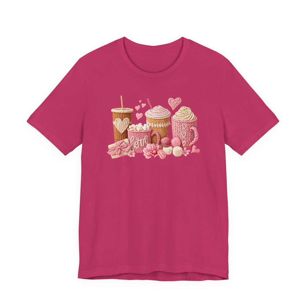 Coffee Love Tee featuring a cozy knitted design with yarn-style beverage cups and hearts, embodying a sweet, handmade vibe on a bright pink T-shirt.