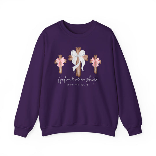 Purple sweatshirt featuring three wooden crosses with bows and God made me an Auntie text, ideal for comfort with a polyester-cotton blend, loose fit.