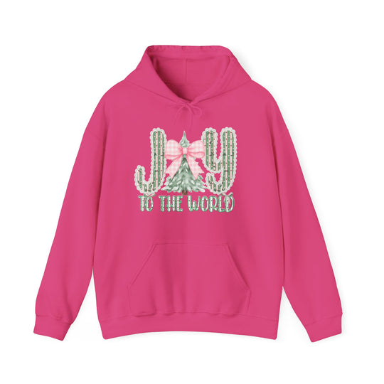 Bright pink Joy to the World hoodie featuring cacti and Christmas tree graphic, spacious kangaroo pocket, and color-matched drawstring, perfect for cozy, stylish wear.