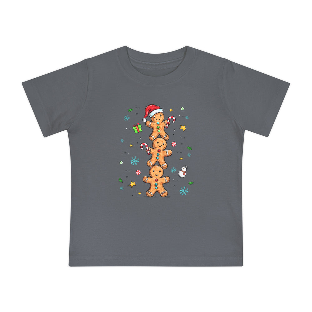 Gingerbread Stack Baby Tee featuring a festive design with gingerbread figures, candy canes, and snowflakes on a dark-gray, soft, durable children's T-shirt from Faith Family Designs.