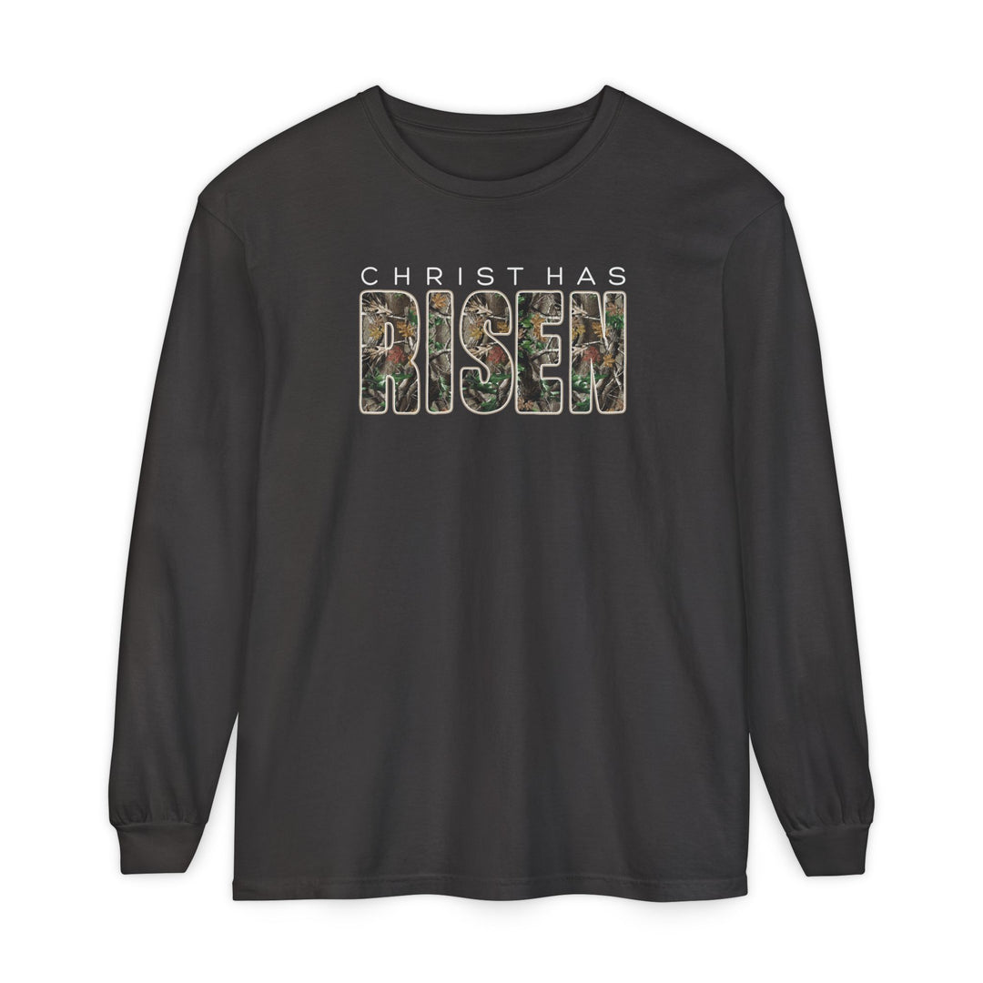 Black long-sleeve tee with CHRIST HAS RISEN text; RISEN features a woodland camouflage pattern, conveying comfort and style.