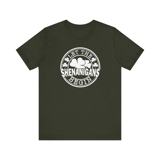 Let The Shenanigans Begin Tee featuring white text on a green shirt, classic fit with ribbed knit collars and dual side seams for durability.
