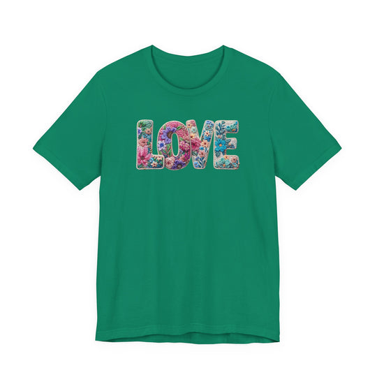 Love Spring Tee: Green short-sleeve shirt with LOVE in floral embroidery-style letters. Soft cotton, retail fit, suitable for all sizes.