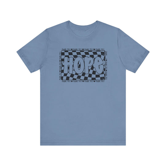 Hope Tee: A blue t-shirt with a black and white graphic design, showcasing a classic unisex fit with ribbed knit collars and durable stitching.