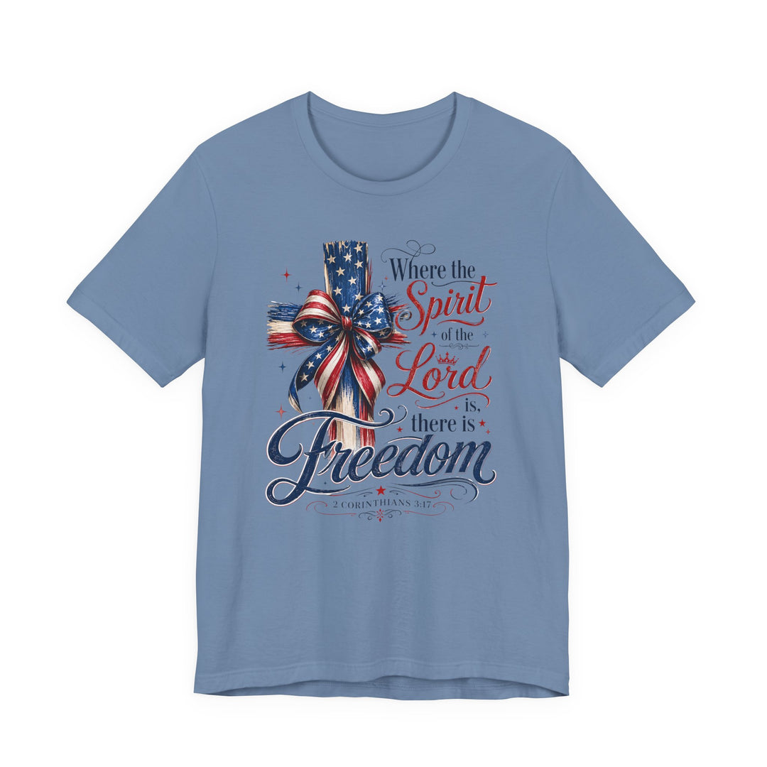 Spirit of the Lord Tee: Light-blue T-shirt featuring a wooden cross with a stars-and-stripes ribbon, and 2 Corinthians 3:17 verse text.
