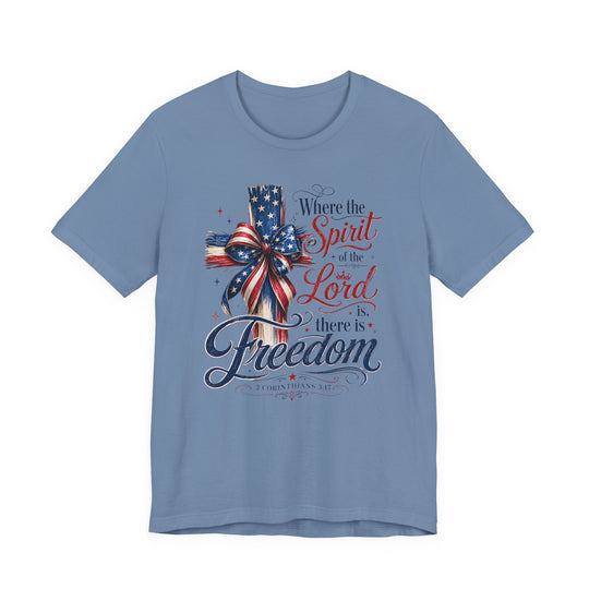 Spirit of the Lord Tee: Light-blue T-shirt featuring a wooden cross with a stars-and-stripes ribbon, and 2 Corinthians 3:17 verse text.