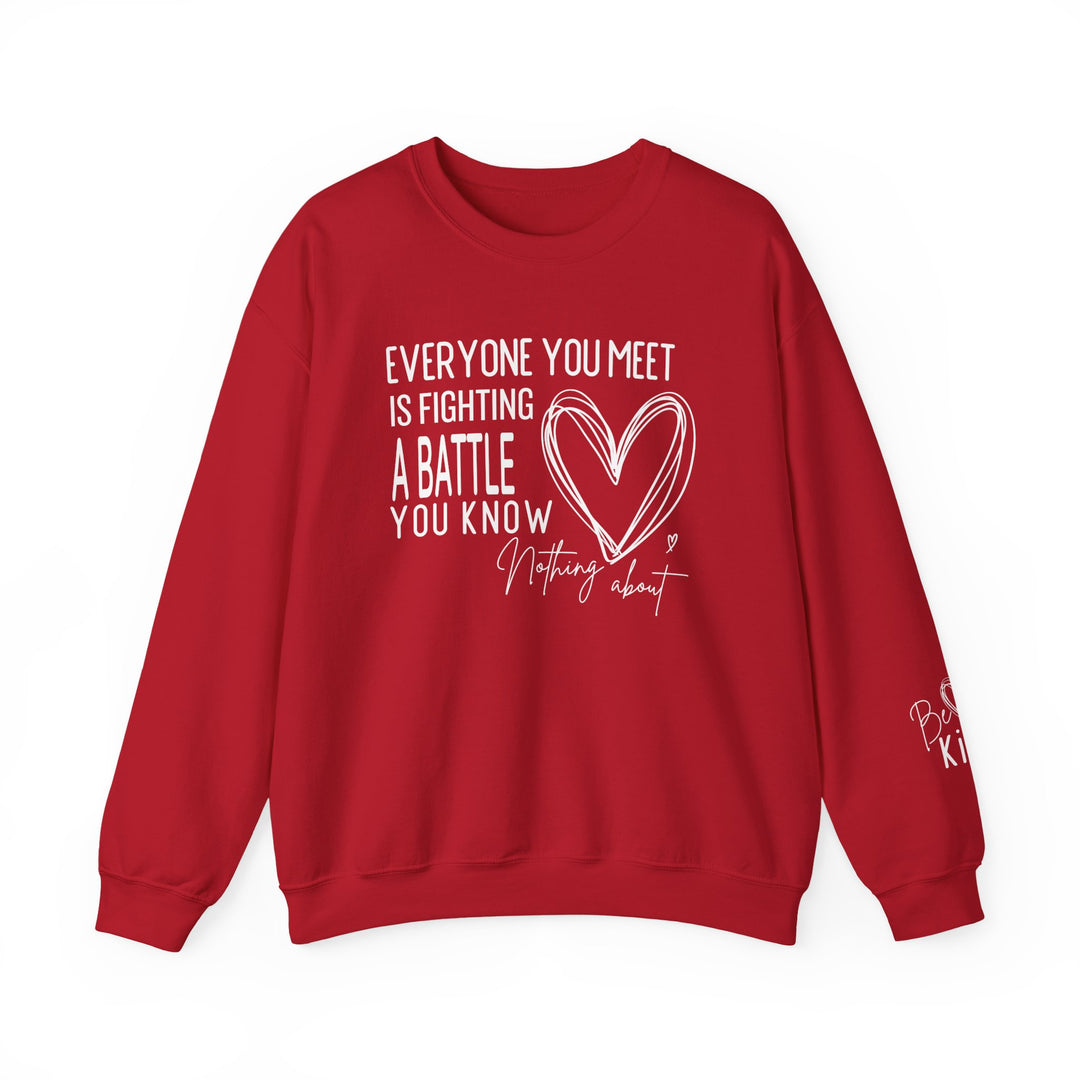 Red crewneck sweatshirt with motivational text Everyone you meet is fighting a battle you know nothing about and Be kind message on sleeve, designed by Faith Family Designs.