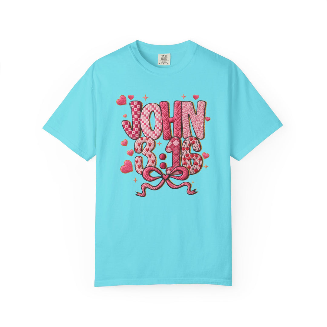 3:16 Tee with JOHN 3:16 in bubble letters, heart patterns, and a pink bow, offering stylish comfort with a relaxed fit.