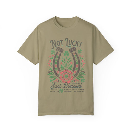 Blessed Tee with green and pink horseshoe graphic, featuring flowers and leaves, on a soft, garment-dyed t-shirt for comfort and style.