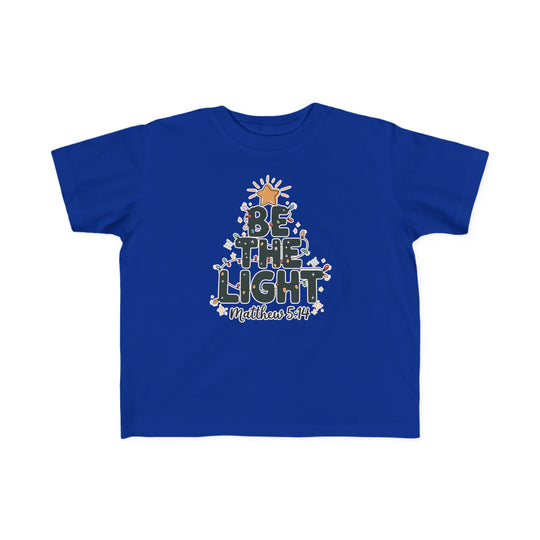 Be the Light Toddler Tee in royal blue with festive BE THE LIGHT design, golden star, string lights, floral accents, and Matthew 5:14 scripture reference.