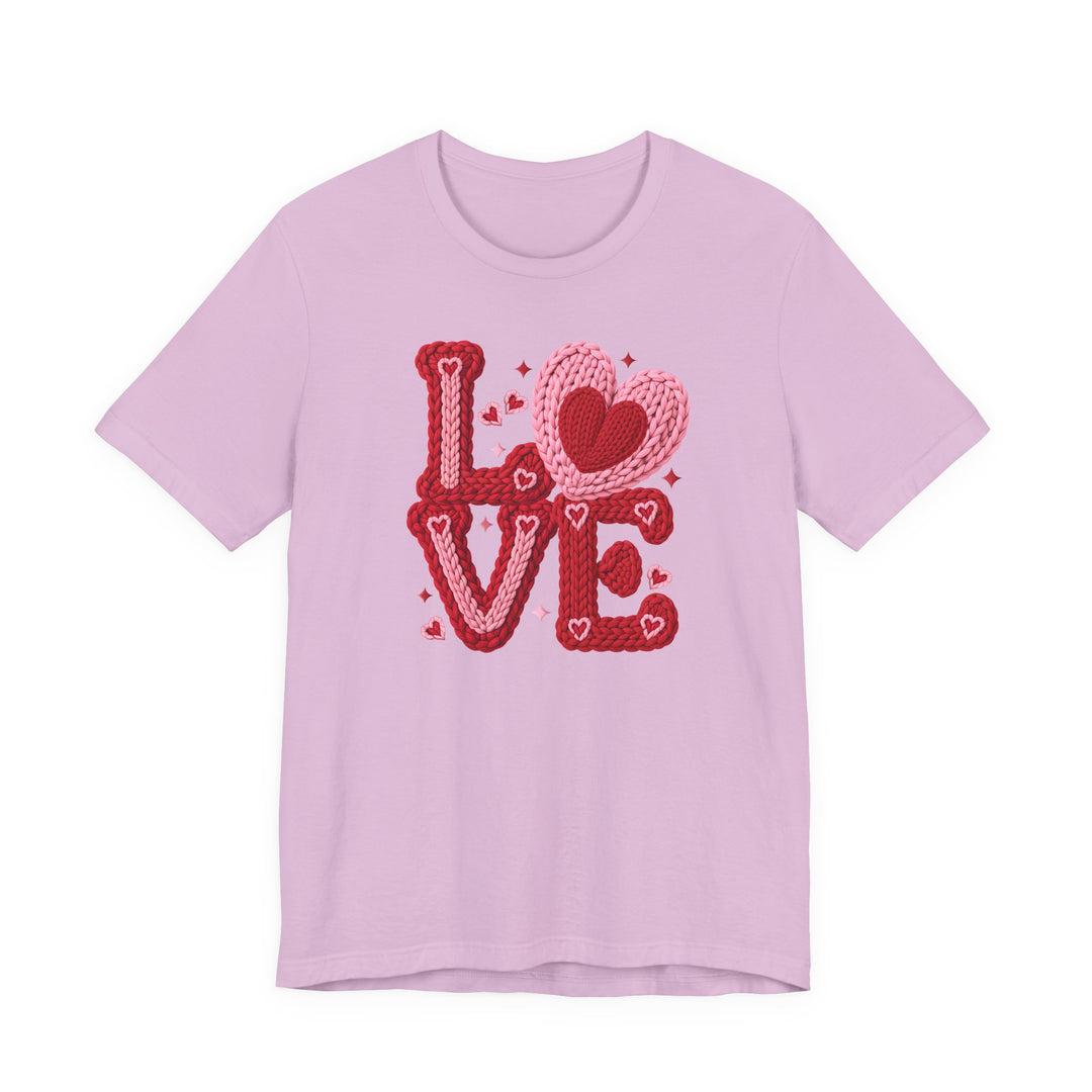 Love Heart Tee featuring a stylized LOVE graphic with overlapping hearts and sparkles, laid flat. Classic unisex fit with soft, durable cotton.