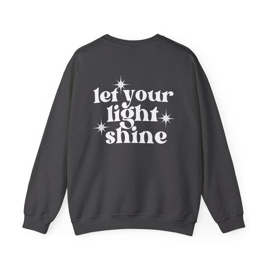 Unisex heavy blend crewneck sweatshirt featuring Let Your Light Shine design. Ribbed knit collar, no itchy side seams. 50% Cotton 50% Polyester, medium-heavy fabric, loose fit, true to size. Dimensions: Width, Length, Sleeve length.