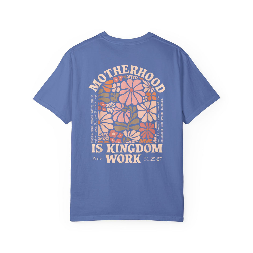 Periwinkle-blue Kingdom Work Tee featuring floral artwork and MOTHERHOOD IS KINGDOM WORK text, referencing Proverbs 31, on durable, relaxed-fit cotton.