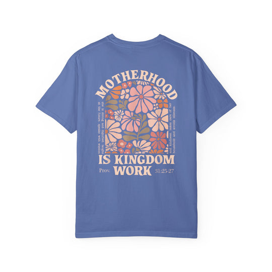 Periwinkle-blue Kingdom Work Tee featuring floral artwork and MOTHERHOOD IS KINGDOM WORK text, referencing Proverbs 31, on durable, relaxed-fit cotton.