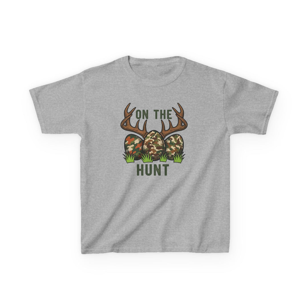 On the Hunt Kids Tee featuring camouflage eggs and deer antlers graphic, perfect for everyday wear with durable, soft cotton blend fabric.