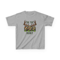 On the Hunt Kids Tee featuring camouflage eggs and deer antlers graphic, perfect for everyday wear with durable, soft cotton blend fabric.