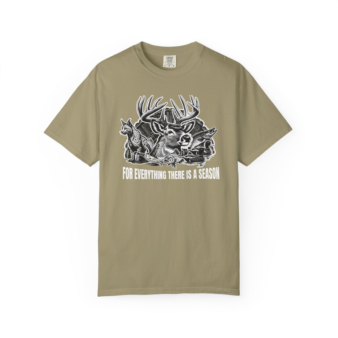 For Everything There is a Season Tee features a black-and-white game animal collage on khaki, highlighting a whitetail buck, fox, duck, and fish.