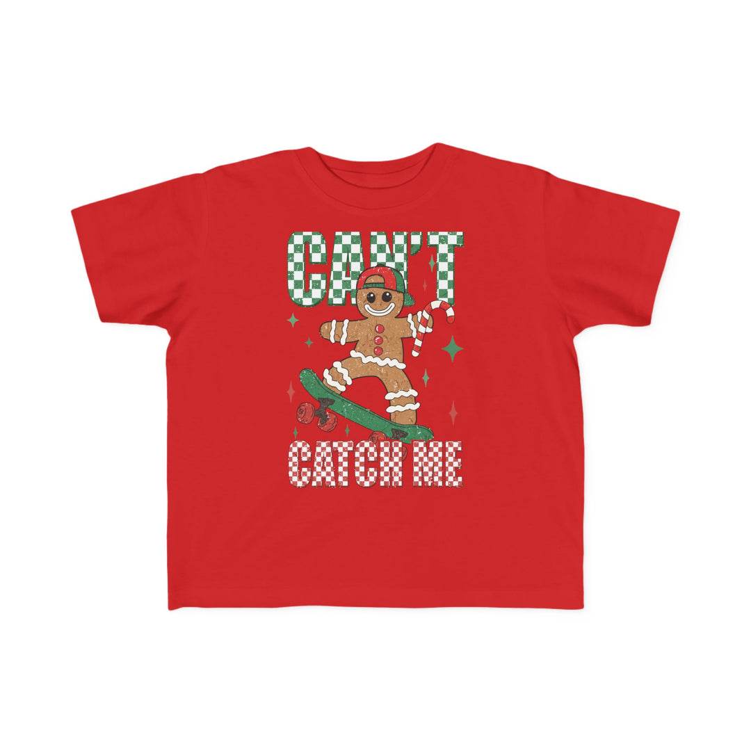 Can't Catch Me Toddler Tee featuring a cartoon gingerbread man on a skateboard with festive accents, designed for comfort and durability.