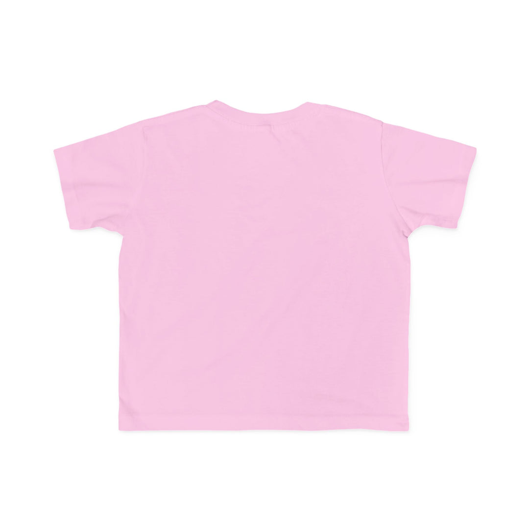 Back view of a light-pink Dino Tree Toddler Tee, short-sleeved, showcasing its soft, cotton fabric ideal for toddlers, designed by Faith Family Designs.