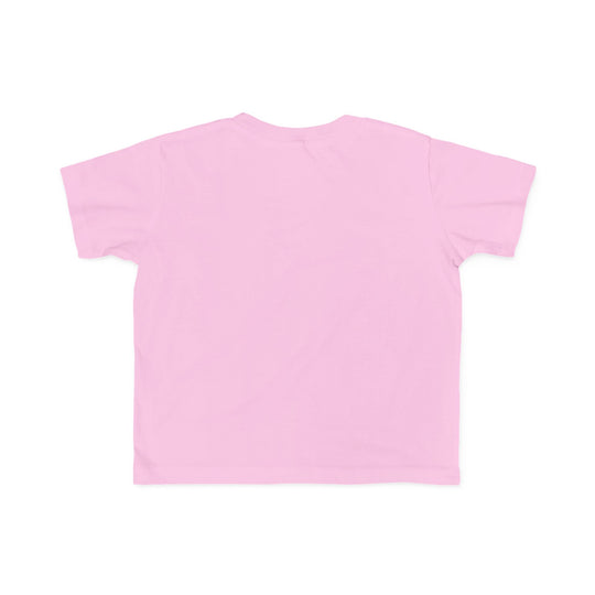 Back view of a light-pink Dino Tree Toddler Tee, short-sleeved, showcasing its soft, cotton fabric ideal for toddlers, designed by Faith Family Designs.