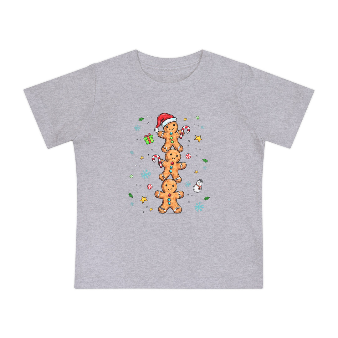 Gingerbread Stack Baby Tee featuring three gingerbread people with festive accents, perfect for baby's holiday attire. Made with soft, durable airlume cotton for comfort.
