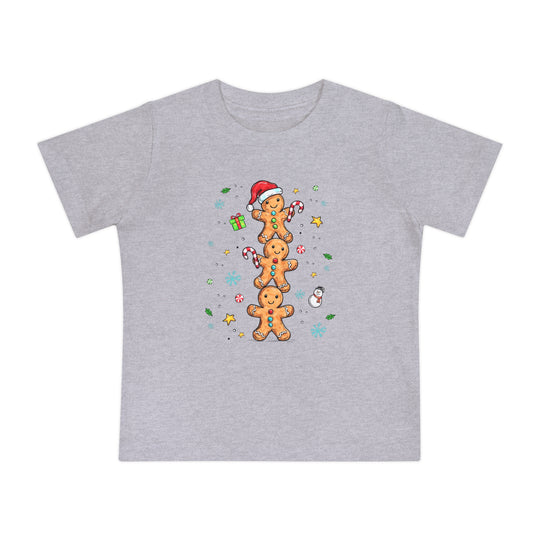 Gingerbread Stack Baby Tee featuring three gingerbread people with festive accents, perfect for baby's holiday attire. Made with soft, durable airlume cotton for comfort.