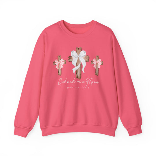 God Made Me a Girl Mama Crew: A pink crewneck sweatshirt featuring three wooden crosses with bows and script text, emphasizing comfort and unique design.