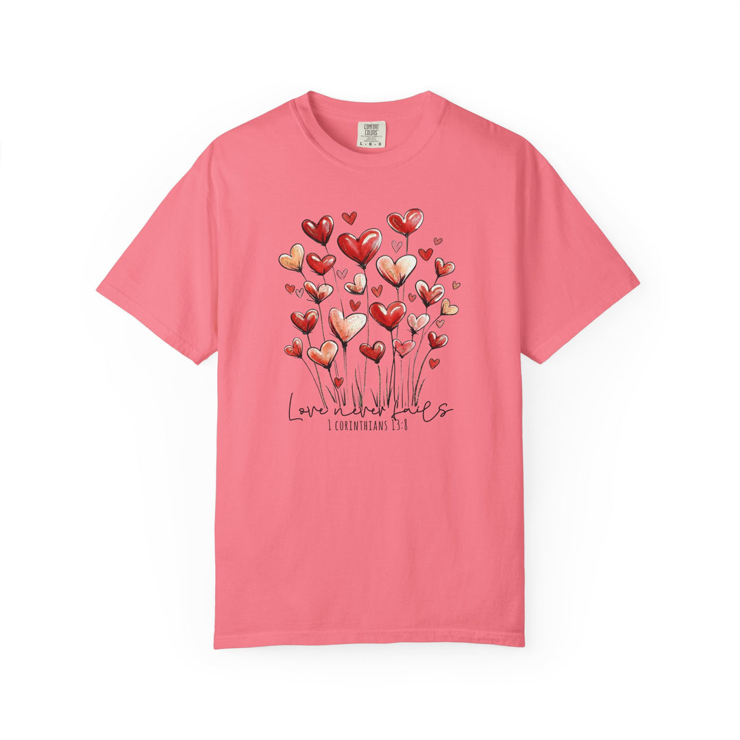 Love Never Fails Tee with hand-drawn heart balloons and 1 Corinthians 13:8 text, perfect for expressing faith and style.