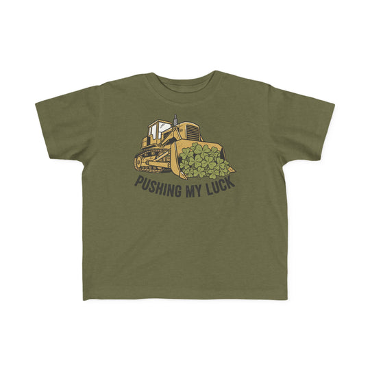 Pushing My Luck Toddler Tee featuring a yellow bulldozer pushing clovers with a playful pun, perfect for toddlers, made of soft, durable cotton.