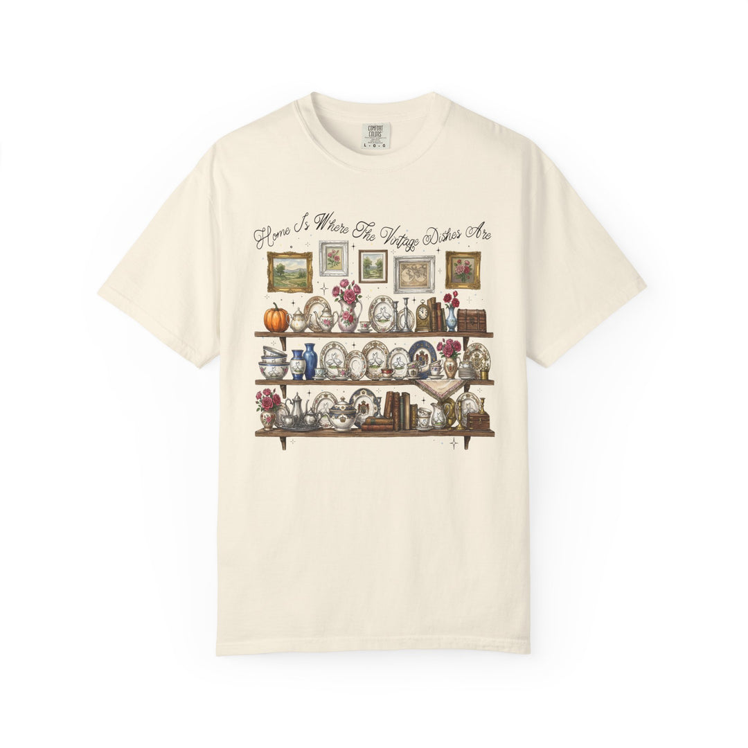 Vintage Dishes Tee featuring a cozy vintage china hutch scene with shelves of plates, teapots, and decor, captioned Home Is Where The Vintage Dishes Are.
