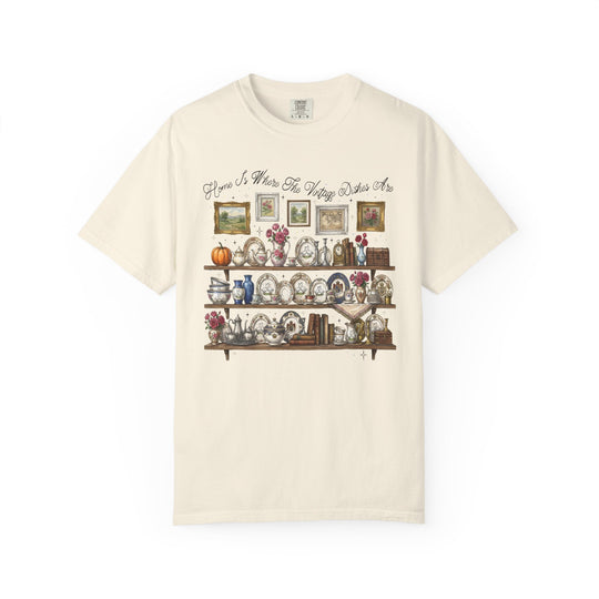 Vintage Dishes Tee featuring a cozy vintage china hutch scene with shelves of plates, teapots, and decor, captioned Home Is Where The Vintage Dishes Are.