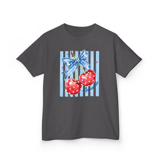 American Cherry Kids Tee features red cherries with stars, a blue ribbon, and America text on a dark-gray background, offering a patriotic design.