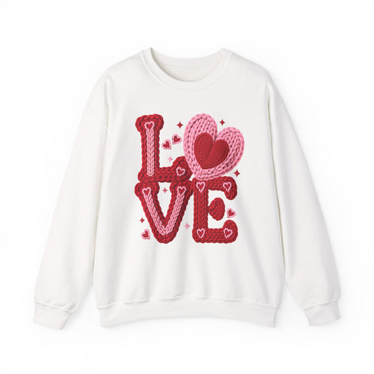 Love Heart Crew sweatshirt featuring LOVE in chunky knit yarn style with heart and sparkle accents, offering a comfortable, unisex fit from Faith Family Designs.