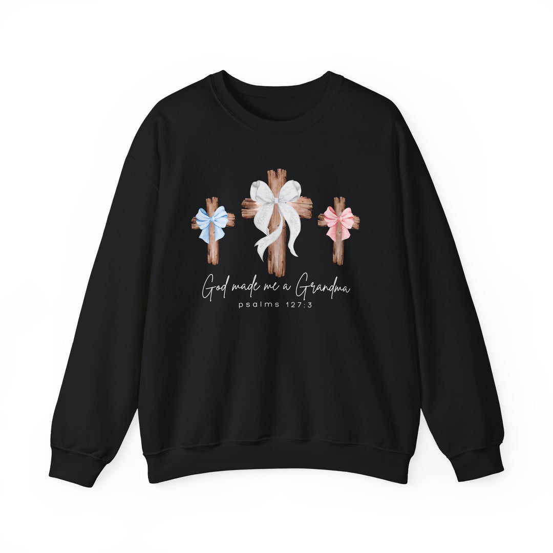 Black crewneck sweatshirt featuring three wooden crosses with bows and God Made Me a Grandma text, offering comfort with a polyester-cotton blend from Faith Family Designs.