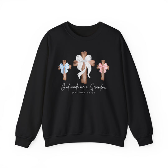 Black crewneck sweatshirt featuring three wooden crosses with bows and God Made Me a Grandma text, offering comfort with a polyester-cotton blend from Faith Family Designs.