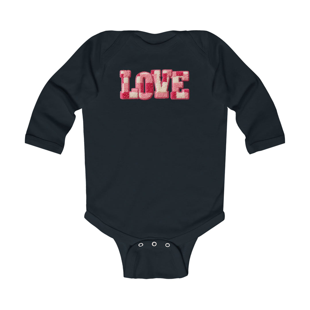 Love Onesie: Navy infant bodysuit with LOVE patch in pink and off-white, long sleeves, and snap closures for easy diaper changes. Soft, durable cotton fabric.