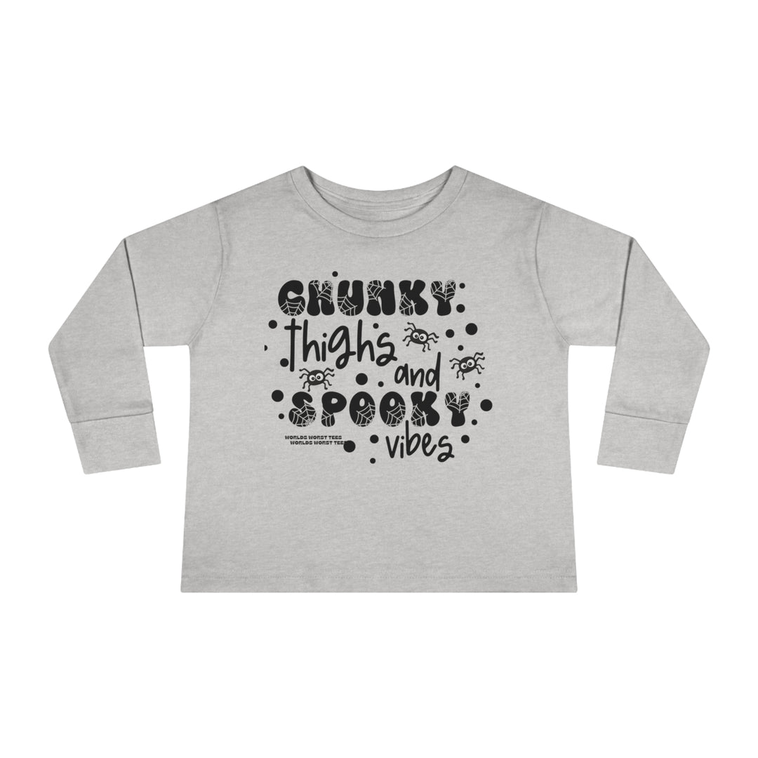 Chunky Thighs and Spooky Vibes Toddler Long Sleeve Tee, featuring black text on a grey shirt. Made of 100% combed ringspun cotton, with topstitched ribbed collar for durability and EasyTear™ label for sensitive skin.